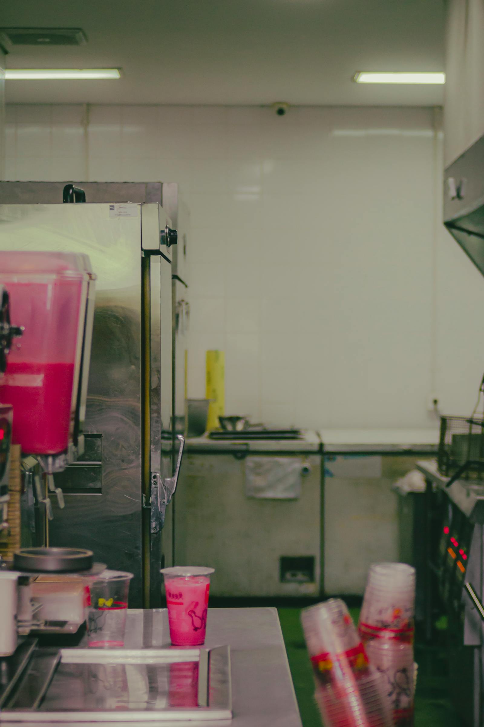 Clean and organised commercial kitchen with stainless steel surfaces